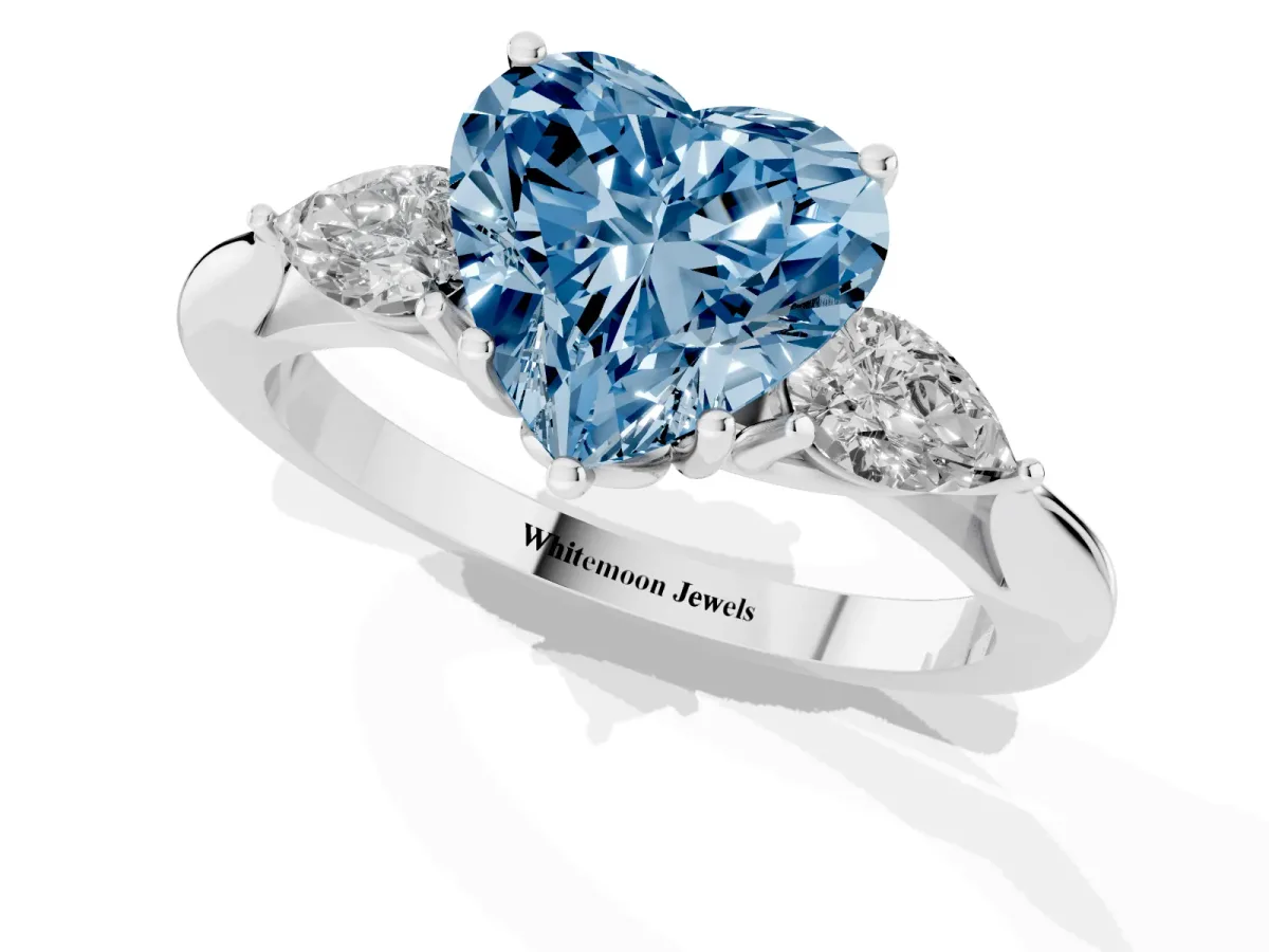Fancy Blue Three-Stone Heart Cut Diamond Ring with Pear Side Stones in Four-Prong Setting Silver