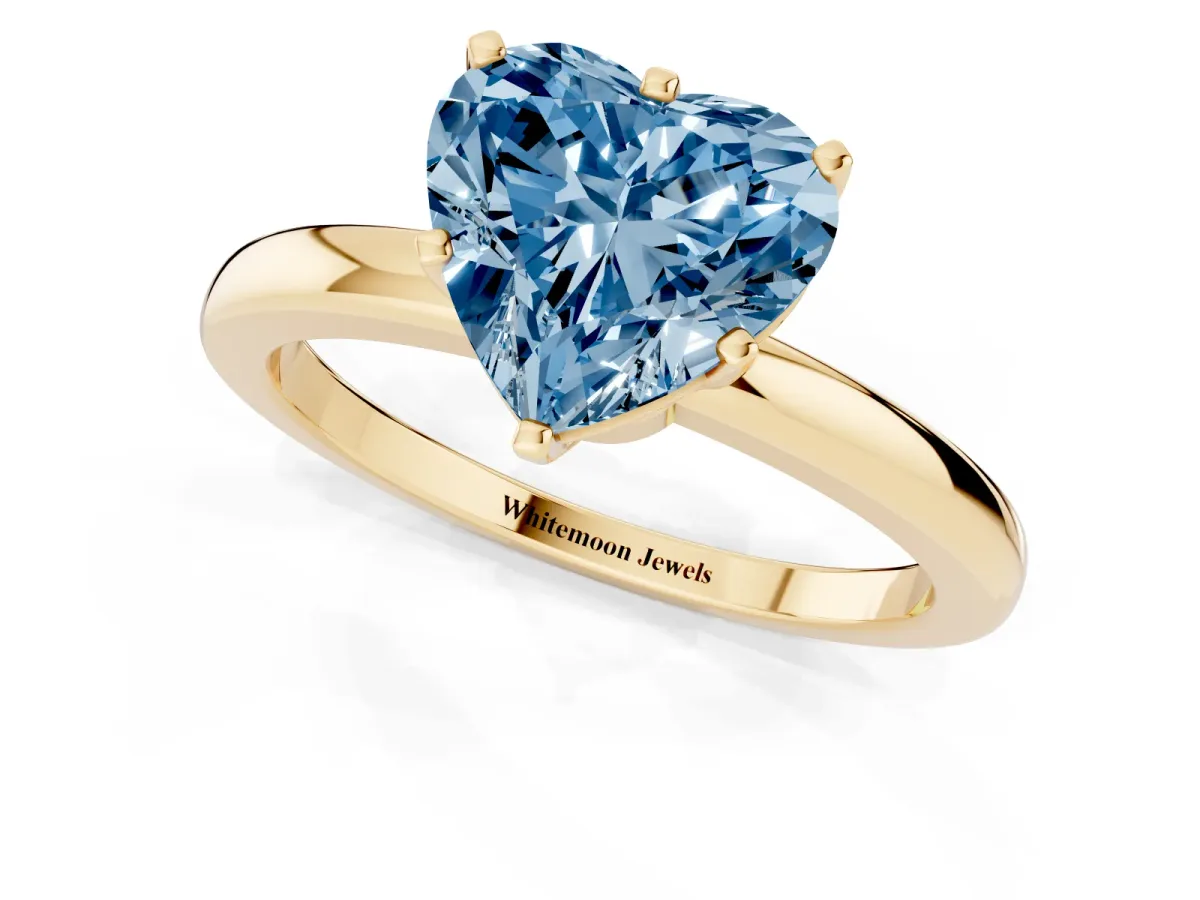 Fancy Blue Heart Cut Solitaire Diamond Ring with Six-Prong Setting on a Classic Band Yellow gold