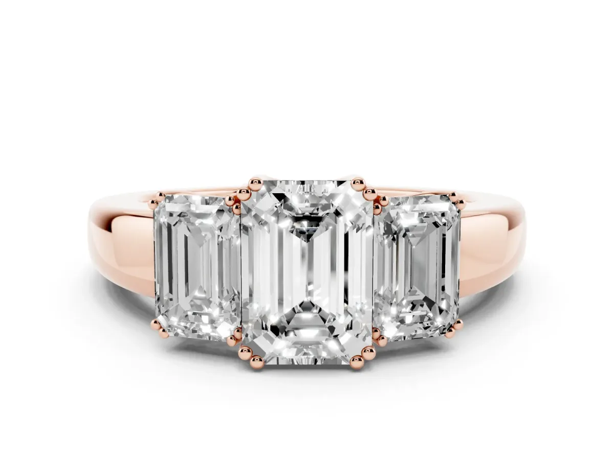 Three-Stone Emerald Cut Cut Diamond Ring with Channel Set Band and Four-Prong Setting Rose gold
