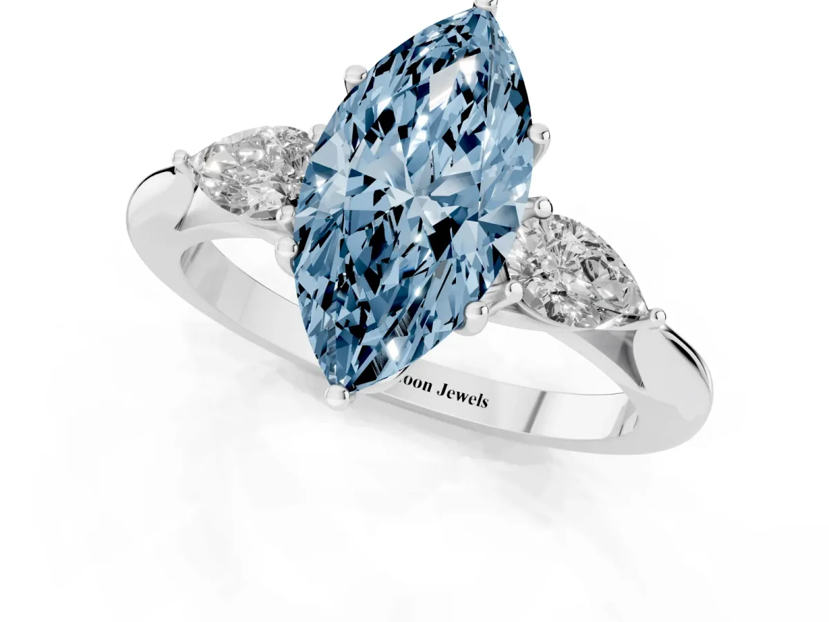 Fancy Blue Three-Stone Marquise Cut Diamond Ring with Pear Side Stones in Four-Prong Setting Silver