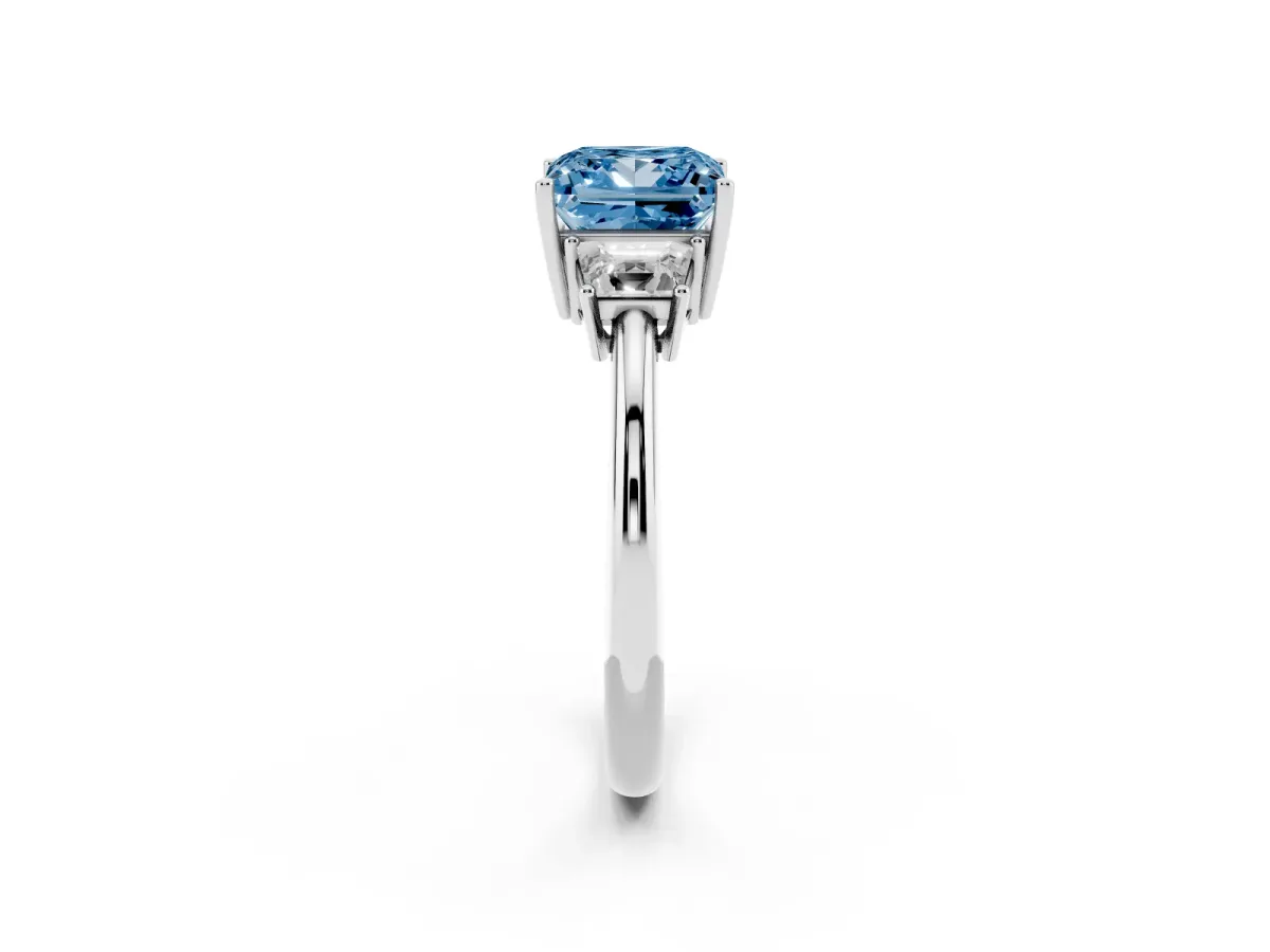 Fancy Blue Princess Cut Diamond Three-Stone Ring with Trapezoid Side Stones and Prong Setting Silver