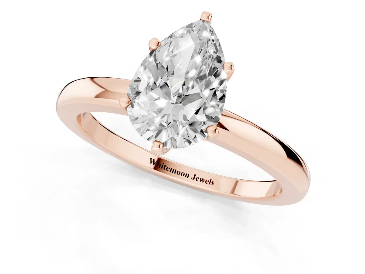 Pear Cut Solitaire Diamond Ring with Six-Prong Setting on a Classic Band Rose gold