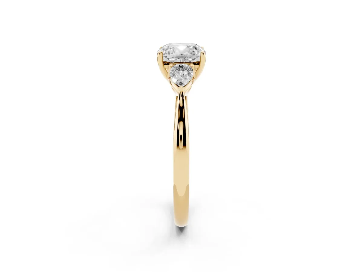 Three-Stone Cushion Cut Brilliant Diamond Solitaire Ring with Tapered Band and Four-Prong Setting Yellow gold