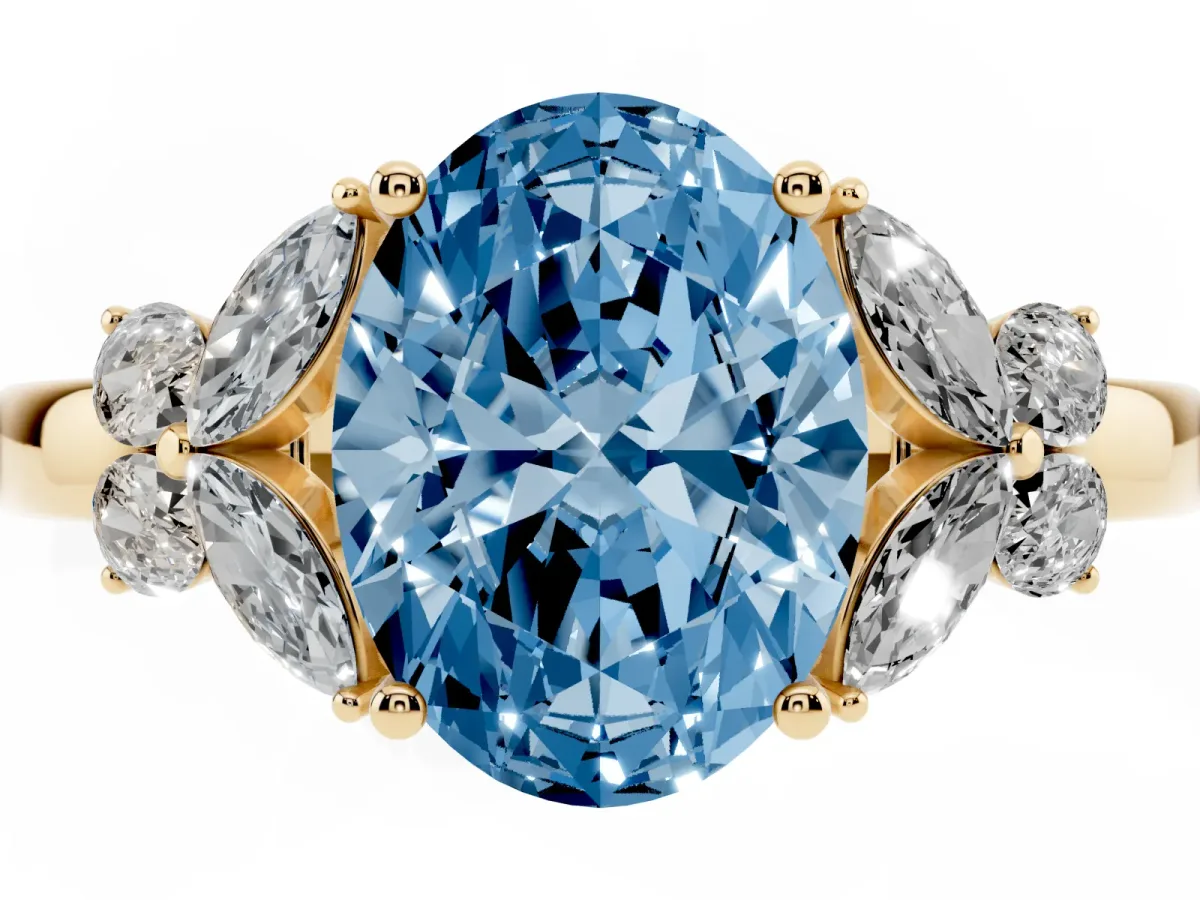 Fancy Blue Oval Cut Cut Solitaire Floral Diamond Ring with Four-Prong Setting Yellow gold