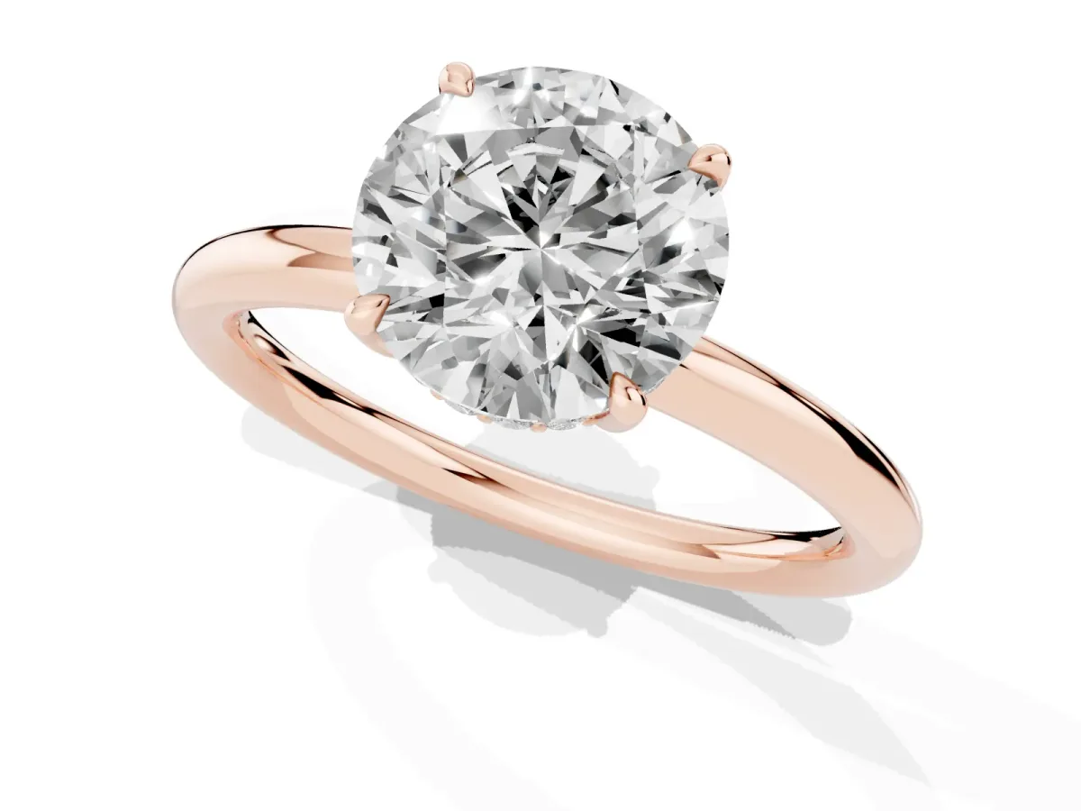 Round Cut Diamond Solitaire Ring with Thin Band and Four-Prong Setting Rose gold