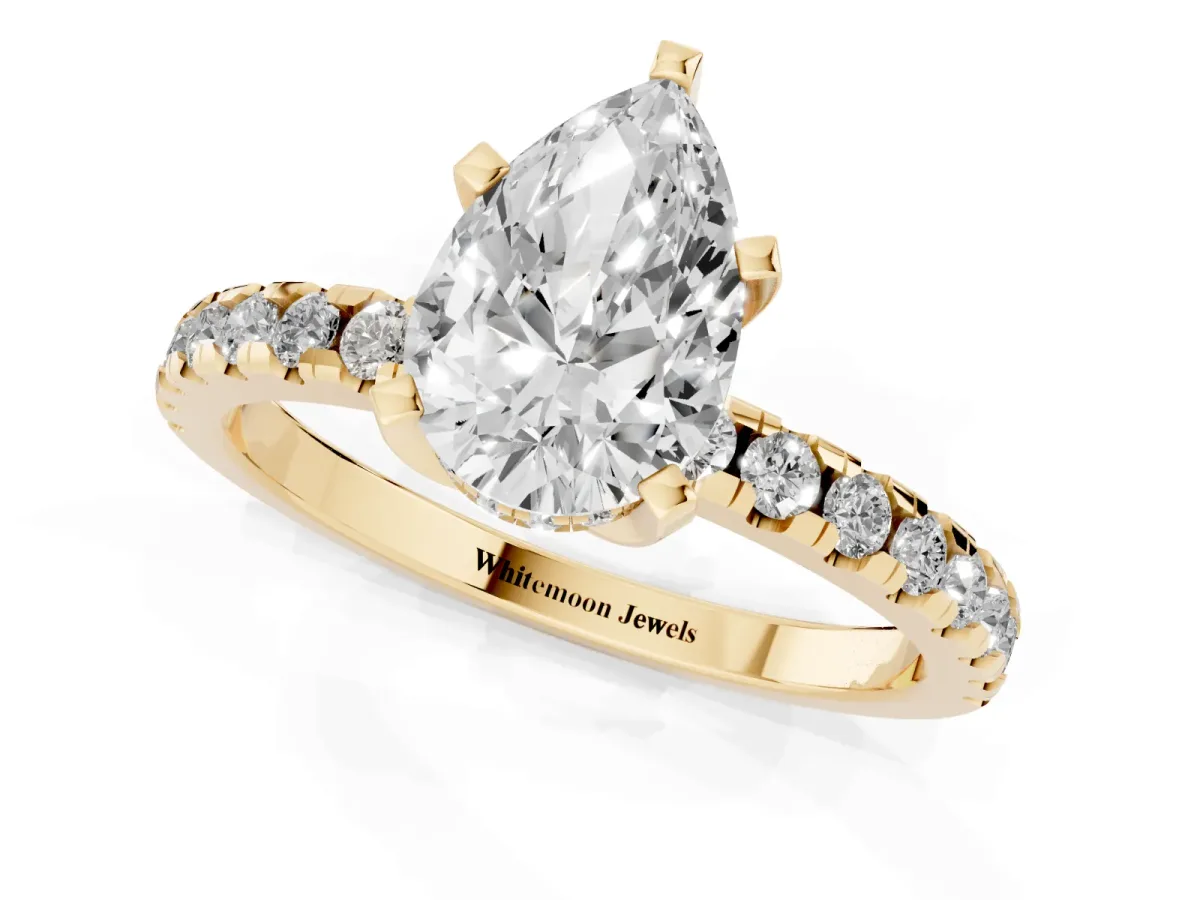 Pear Cut Diamond Solitaire Ring with Round Pavé Band and Four-Prong Setting Yellow gold