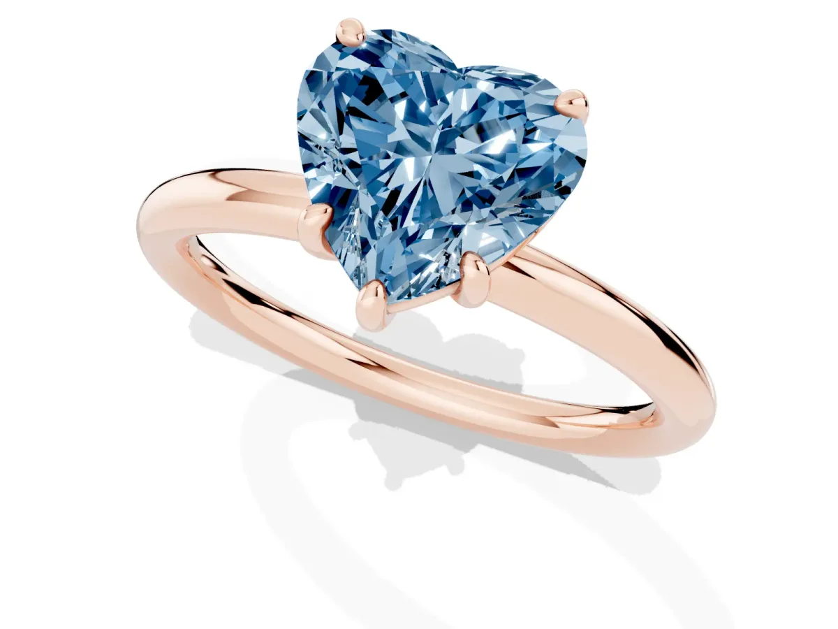 Fancy Blue Heart Cut Solitaire Diamond Ring with Four-Prong Setting on a Plain Band Rose gold