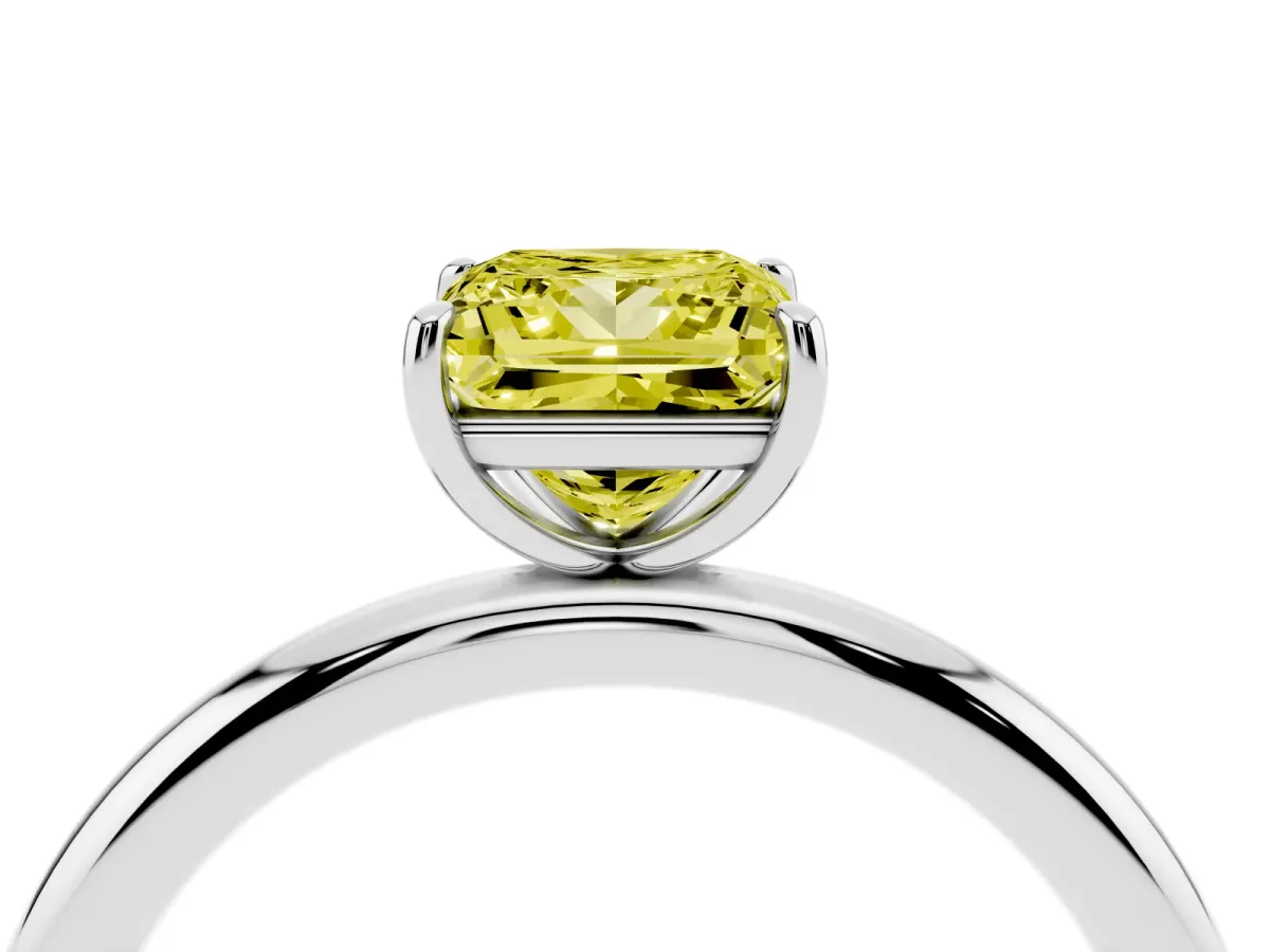 Fancy Yellow Princess Cut Solitaire Diamond Ring with Four-Prong Setting on a Plain Band Silver