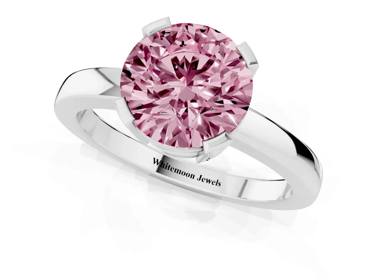 Fancy Pink Round Cut Cut Solitaire Ring with Four-Prong Setting and Classic Band Silver