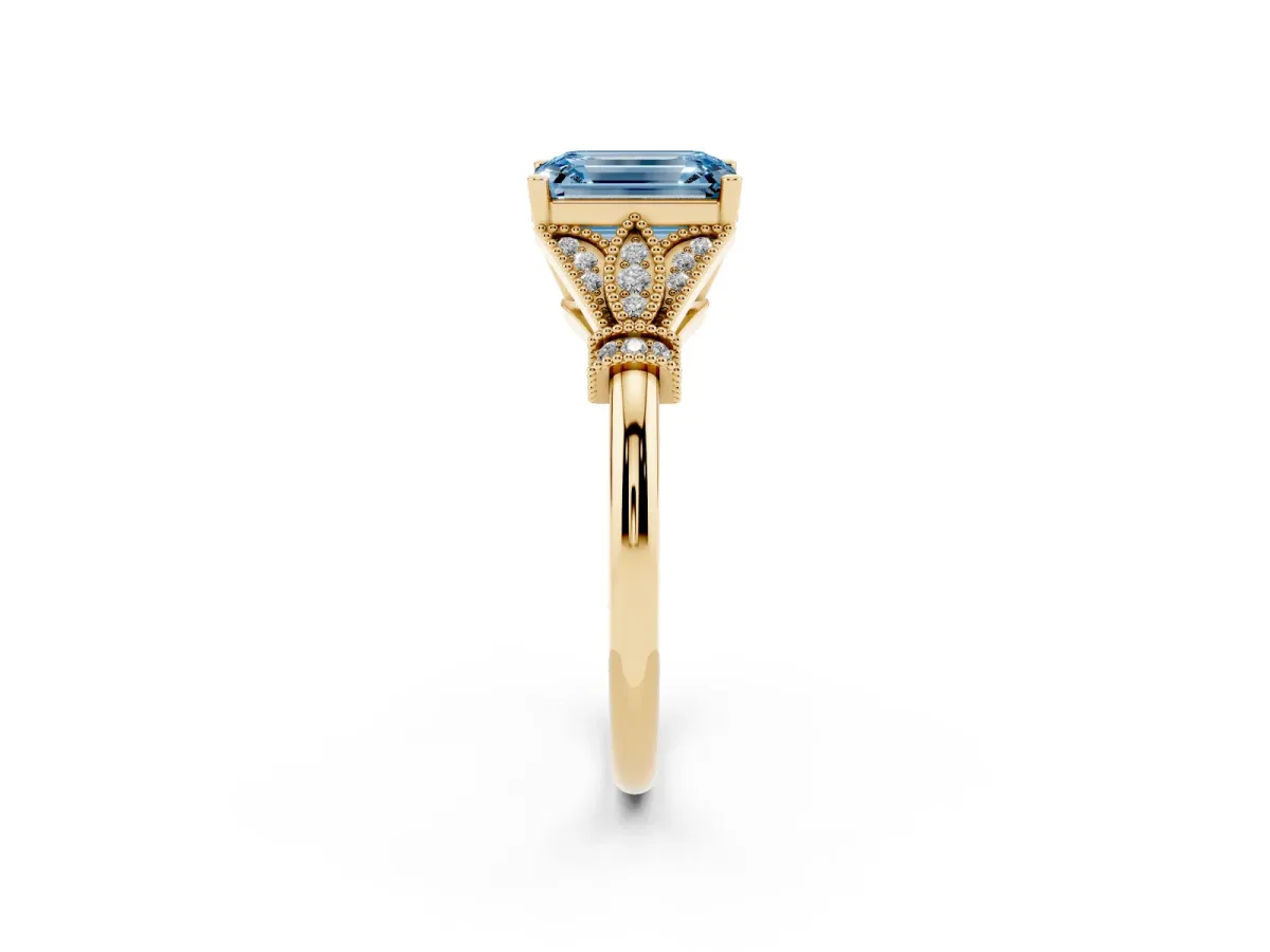 Fancy Blue Emerald Cut Diamond Solitaire Ring with Floral Filigree and Pave Accents Yellow gold