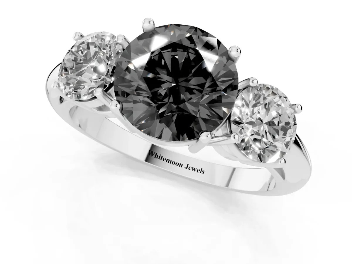 Fancy Black Three-Stone Round Cut Cut Diamond Engagement Ring with Prong Setting on a White Gold Band Platinum