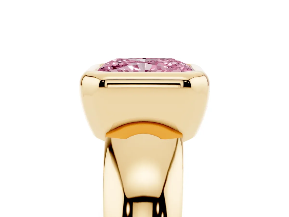 Fancy Pink Bezel Set Radiant Cut Solitaire Ring with Wide Band Yellow gold