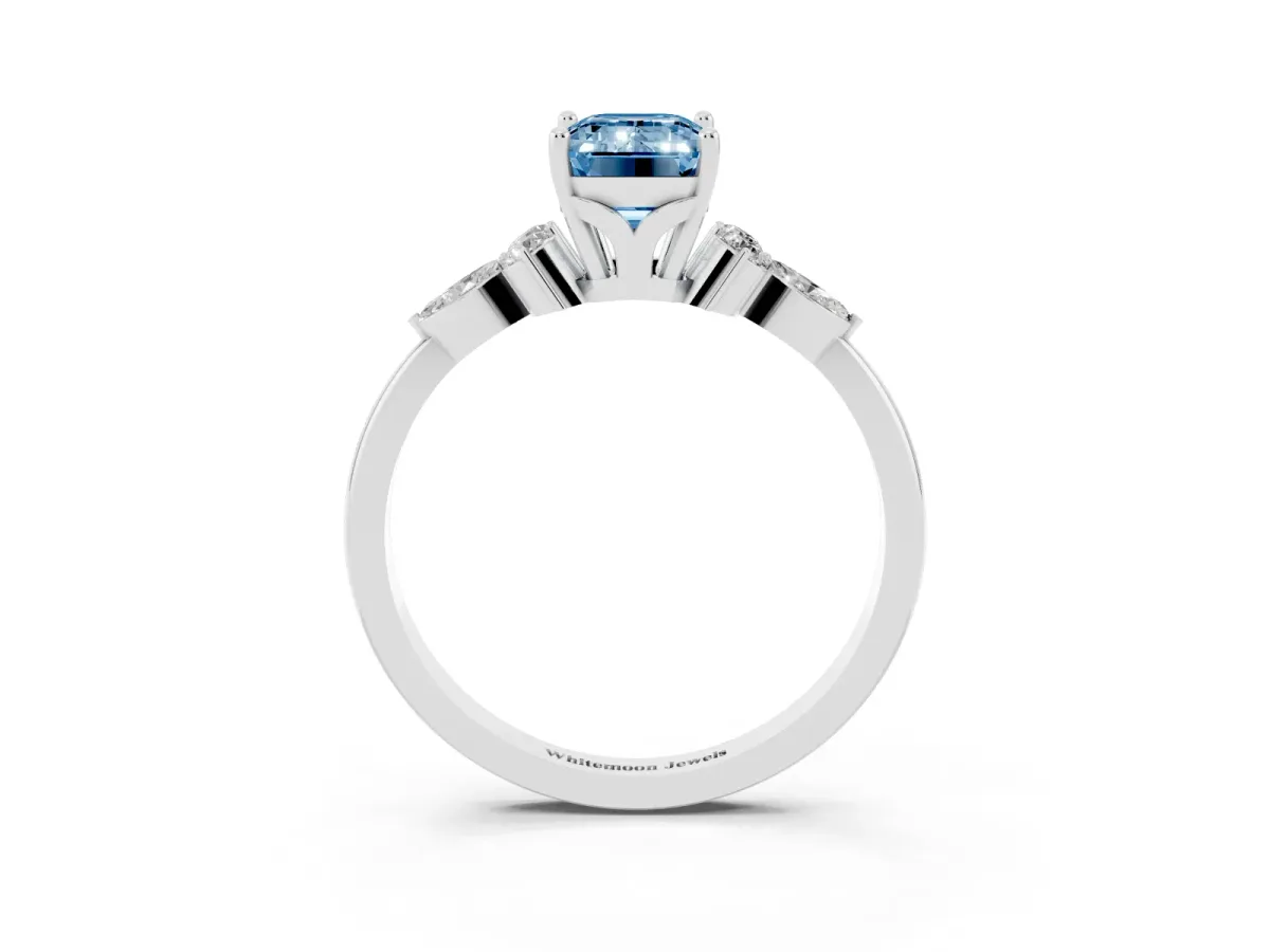 Fancy Blue Emerald Cut Brilliant Diamond Solitaire Ring with Pear Side Stones and Four-Prong Setting Silver