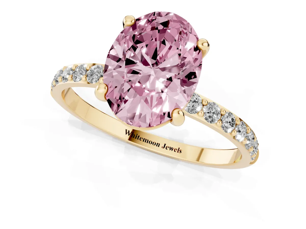 Fancy Pink Oval Cut Diamond Solitaire Ring with Round Pavé Band and Prong Setting Yellow gold
