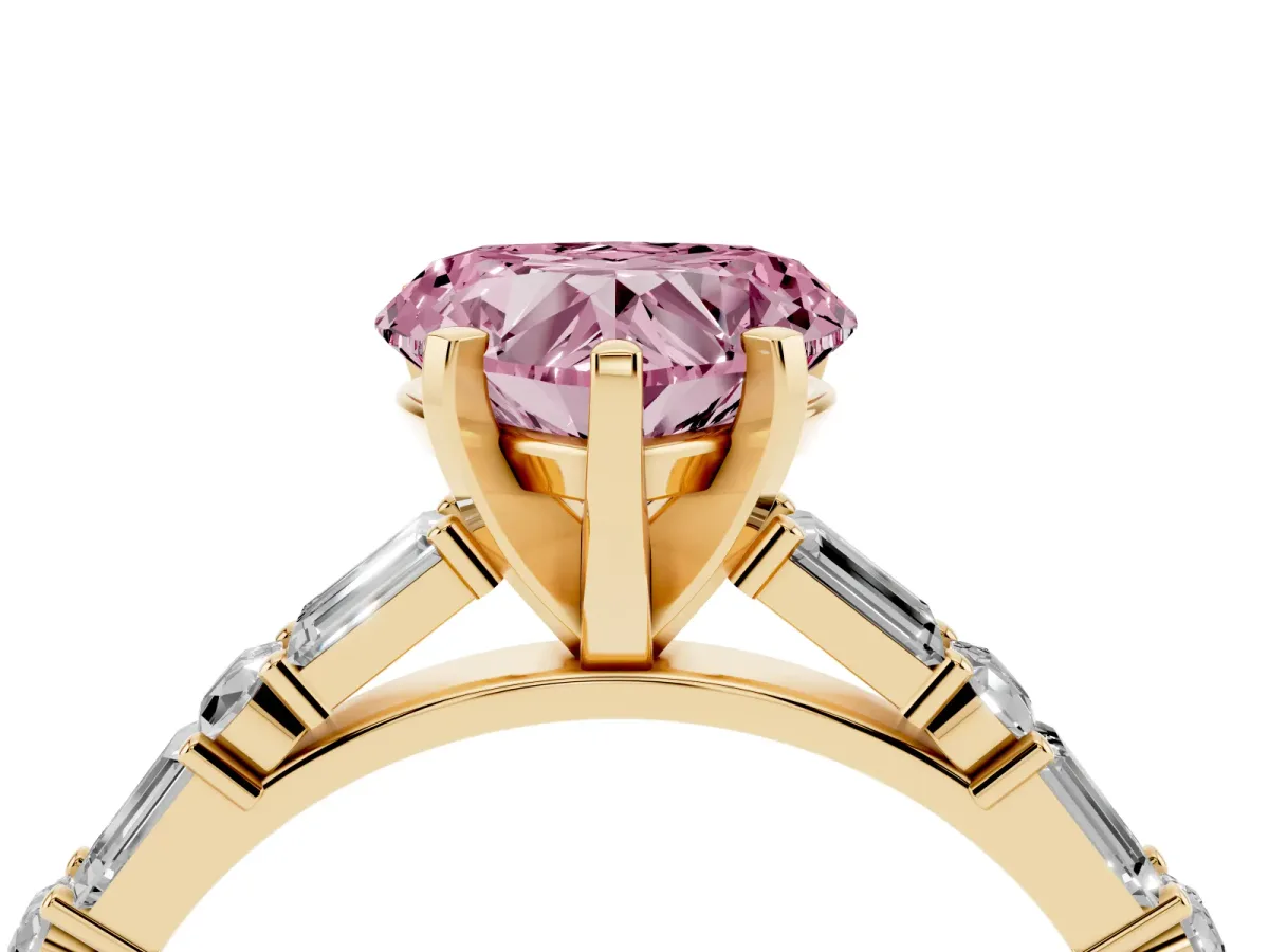 Fancy Pink Heart Cut Diamond Solitaire with Side Baguettes and Channel Set Band Yellow gold