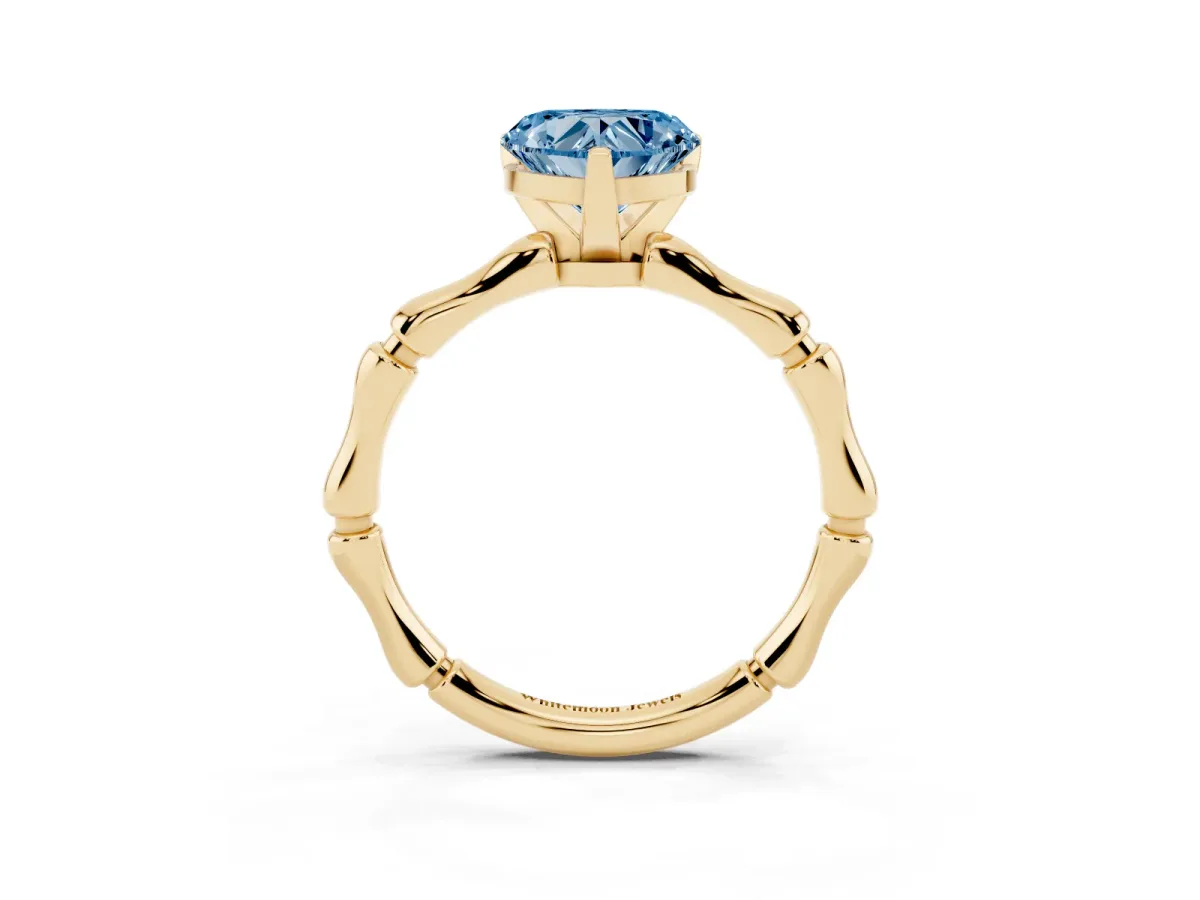 Fancy Blue Heart Cut Solitaire Diamond Ring with Bamboo Band and Four-Prong Setting Yellow gold