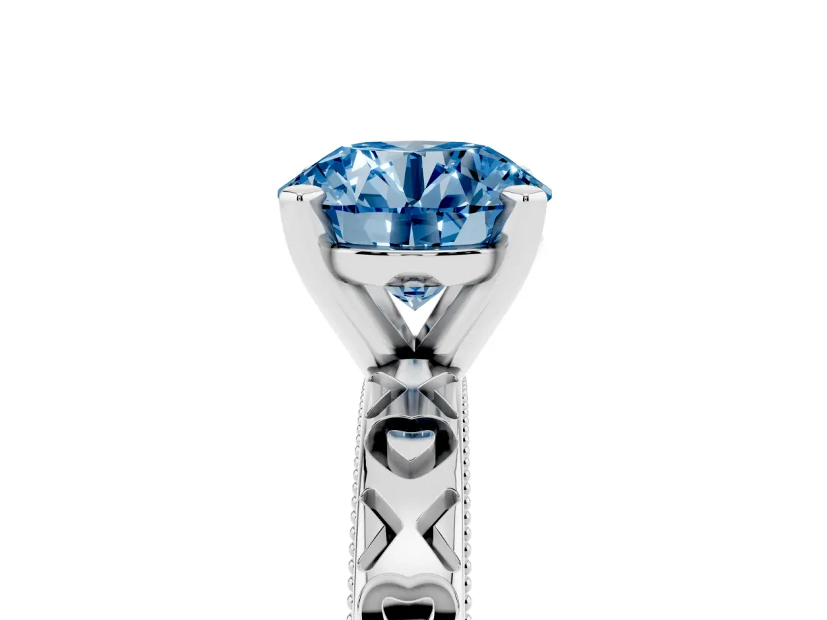 Fancy Blue Round Cut Solitaire Diamond Engagement Ring with XO Engraved Band and Four-Prong Setting Silver