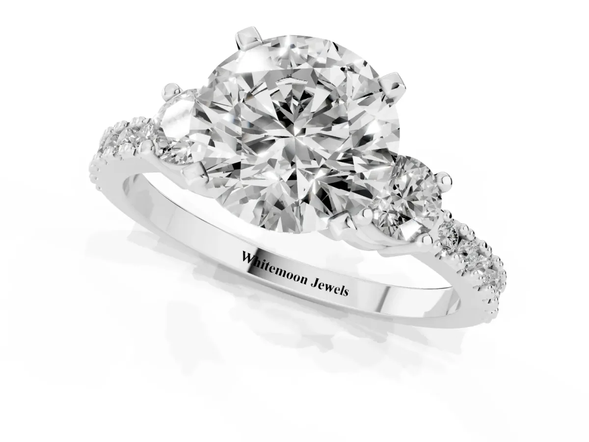 Round Cut Three-Stone Diamond Pavé Band with Prong Setting White gold