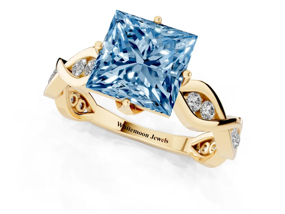 Fancy Blue Princess Cut Solitaire Twist Band with Leaf Prong Setting Yellow gold