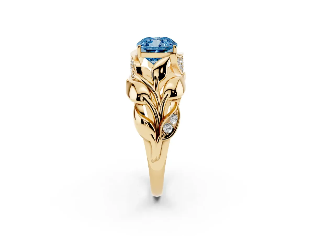 Fancy Blue Cushion Cut Diamond Leaf-Inspired Engagement Ring with Round Accents and Prong Setting Yellow gold