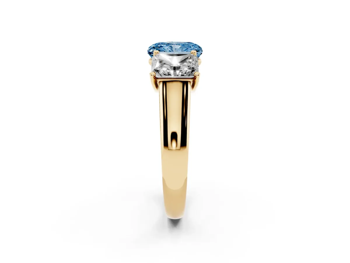 Fancy Blue Radiant Cut Three-Stone Diamond Ring with Prong Setting on a Classic Band Yellow gold