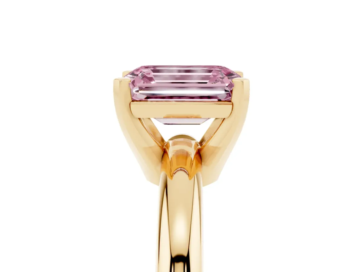 Fancy Pink Emerald Cut Diamond Solitaire Engagement Ring with Round Band and Four-Prong Setting Yellow gold