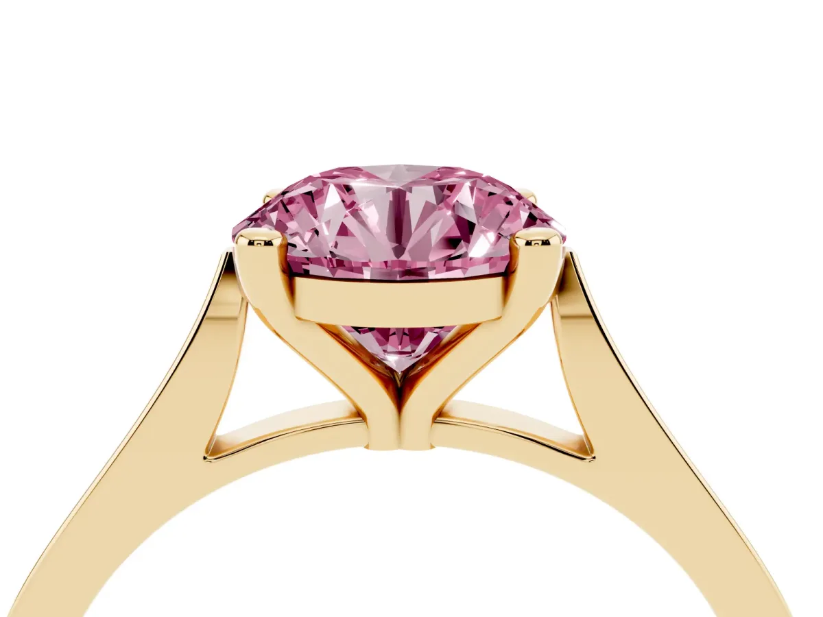 Fancy Pink Round Cut Solitaire Diamond Ring with Four-Prong Setting and Tapered Band Yellow gold