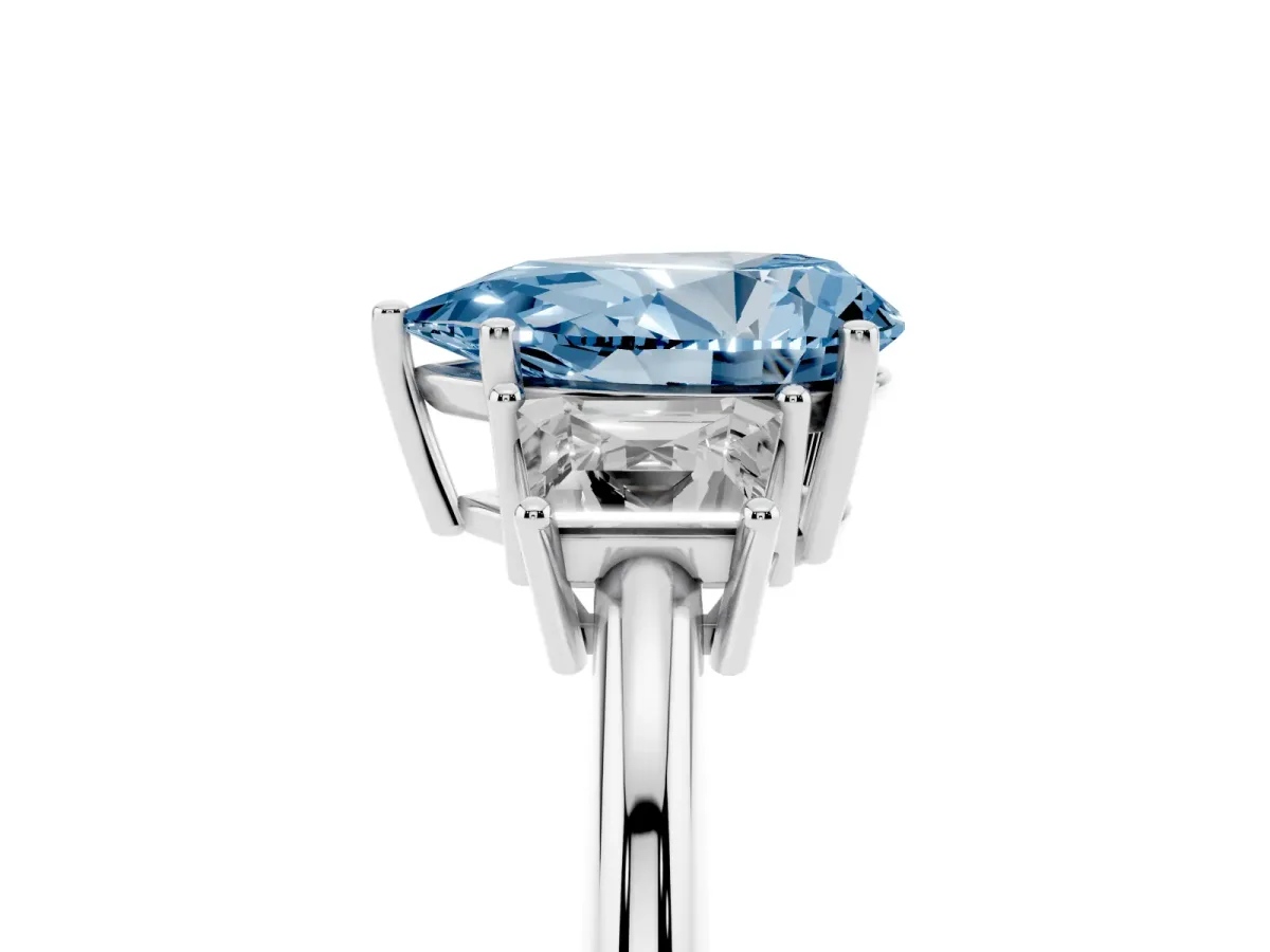 Fancy Blue Pear Cut Diamond Three-Stone Ring with Trapezoid Side Stones and Prong Setting Platinum