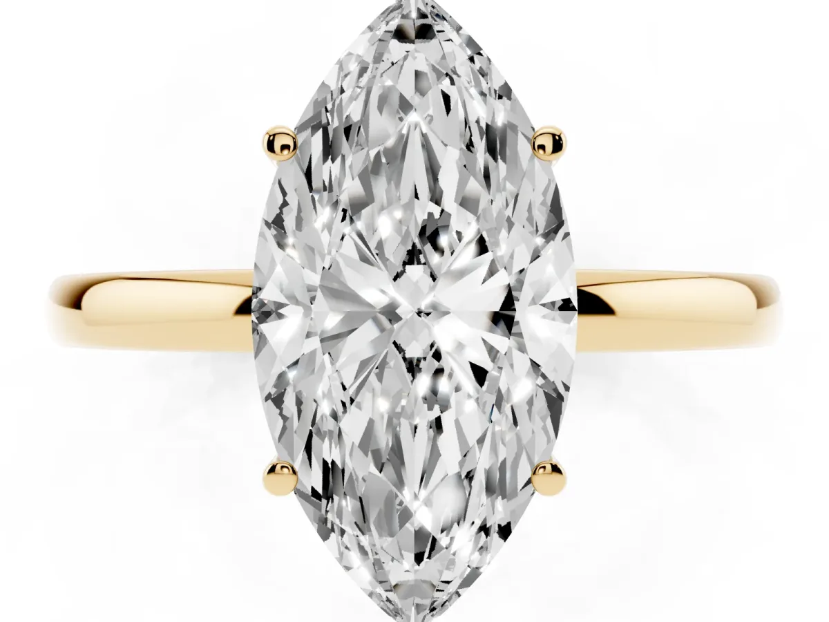 Marquise Cut Solitaire Diamond Ring with Prong Setting and Plain Band Yellow gold