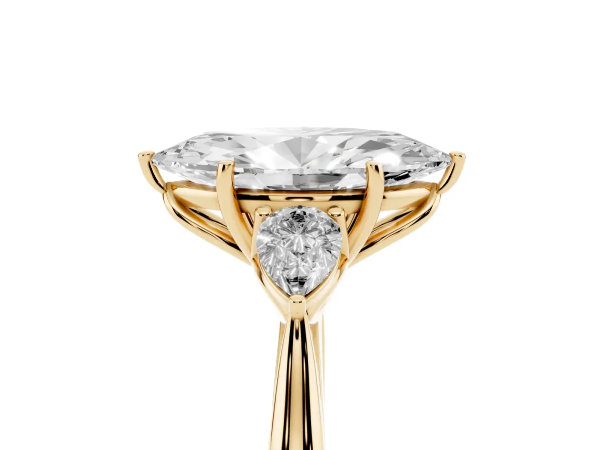 Marquise Cut Diamond Three-Stone Ring with Pear Side Stones and Prong Setting Yellow gold