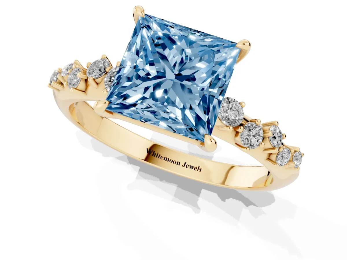 Fancy Blue Princess Cut Diamond Cluster Side Stone Solitaire Ring with Prong Setting Yellow gold