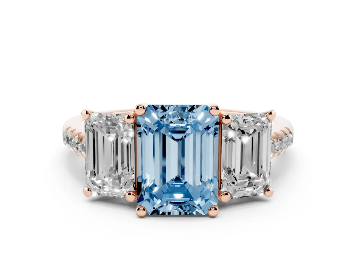 Fancy Blue Three-Stone Emerald Cut Diamond Ring with Round Pavé Band and Prong Setting Rose gold