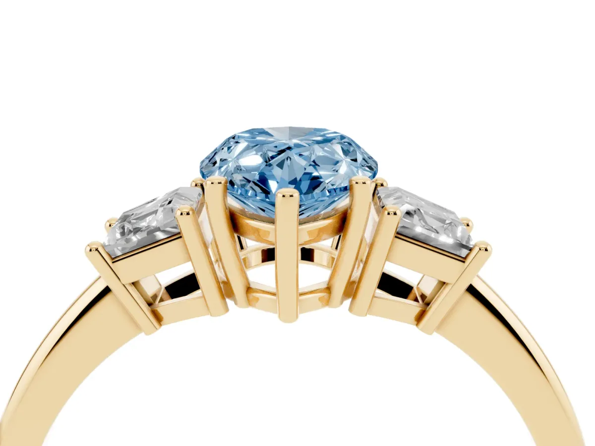 Fancy Blue Pear Cut Diamond Three-Stone Ring with Trapezoid Side Stones and Prong Setting Yellow gold