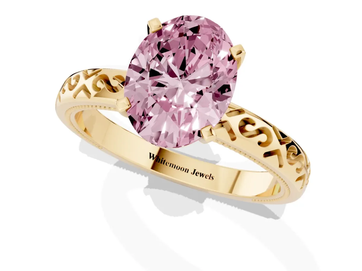 Fancy Pink Oval Cut Solitaire Engagement Ring with Scrollwork Band and Four-Prong Setting Yellow gold