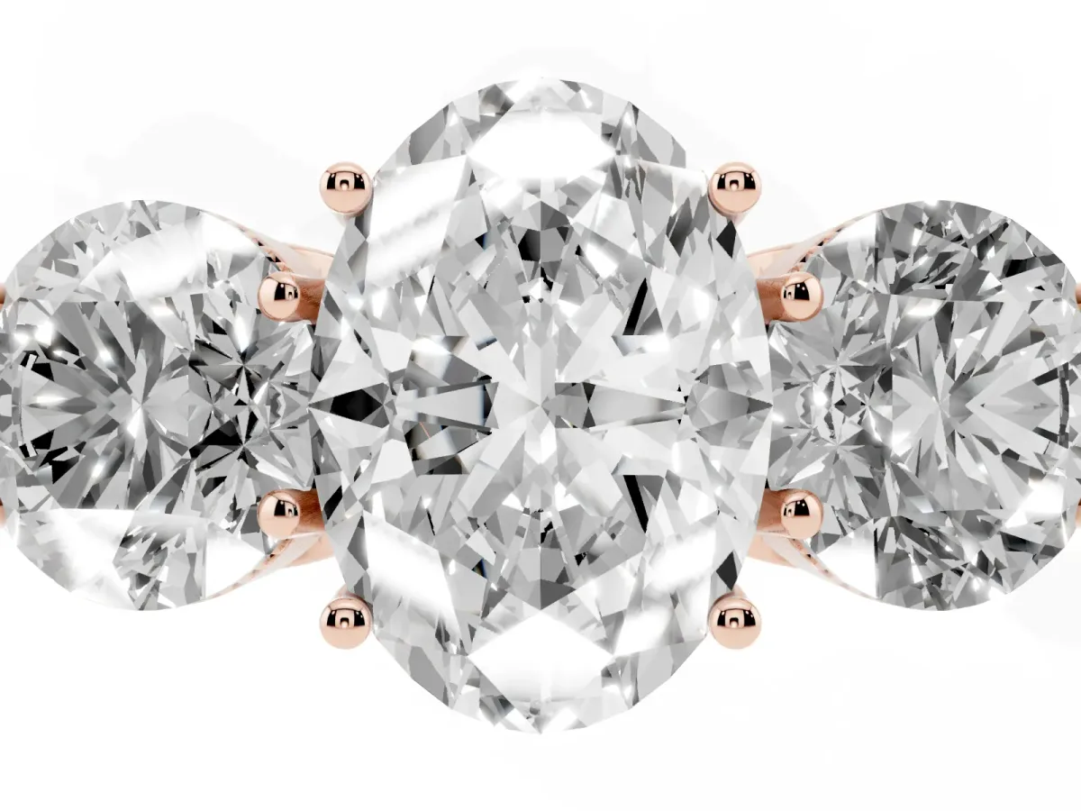 Three-Stone Oval Cut Diamond Engagement Ring with Prong Setting on a Classic Band Rose gold