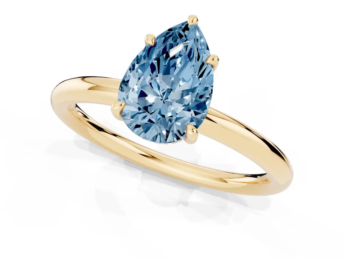 Fancy Blue Pear Cut Diamond Solitaire Ring with Thin Band and Four-Prong Setting Yellow gold
