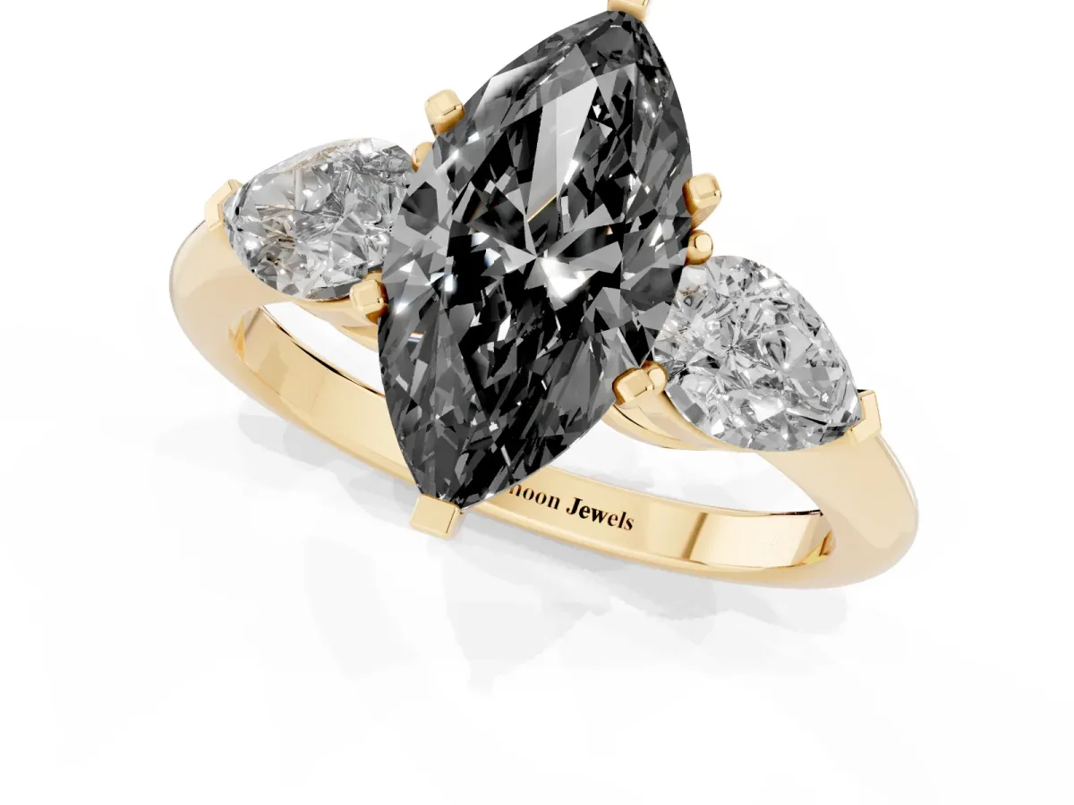 Fancy Black Three-Stone Marquise Cut Diamond Ring with Pear Side Stones and Four-Prong Setting Yellow gold