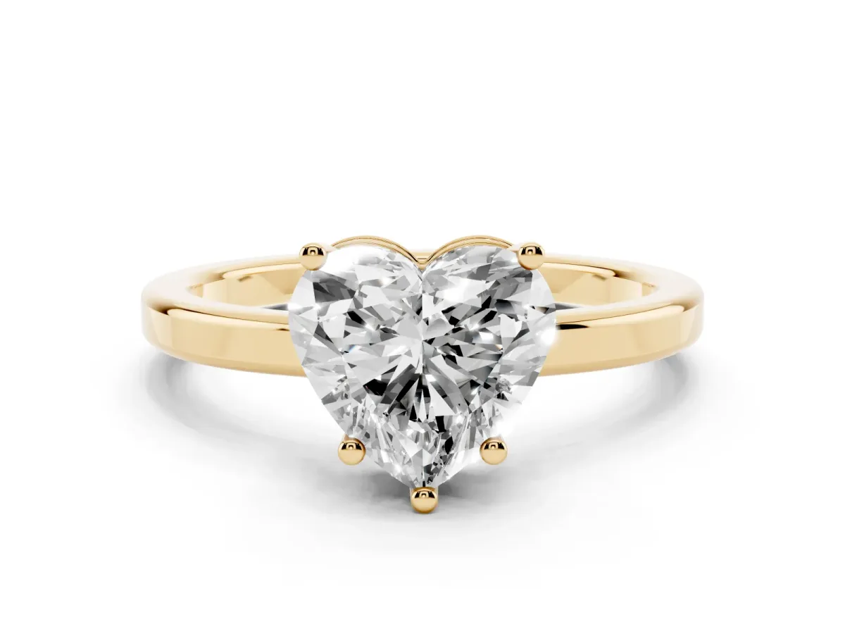 Heart Cut Cut Solitaire Engagement Ring with Four-Prong Setting on a Classic Band Yellow gold