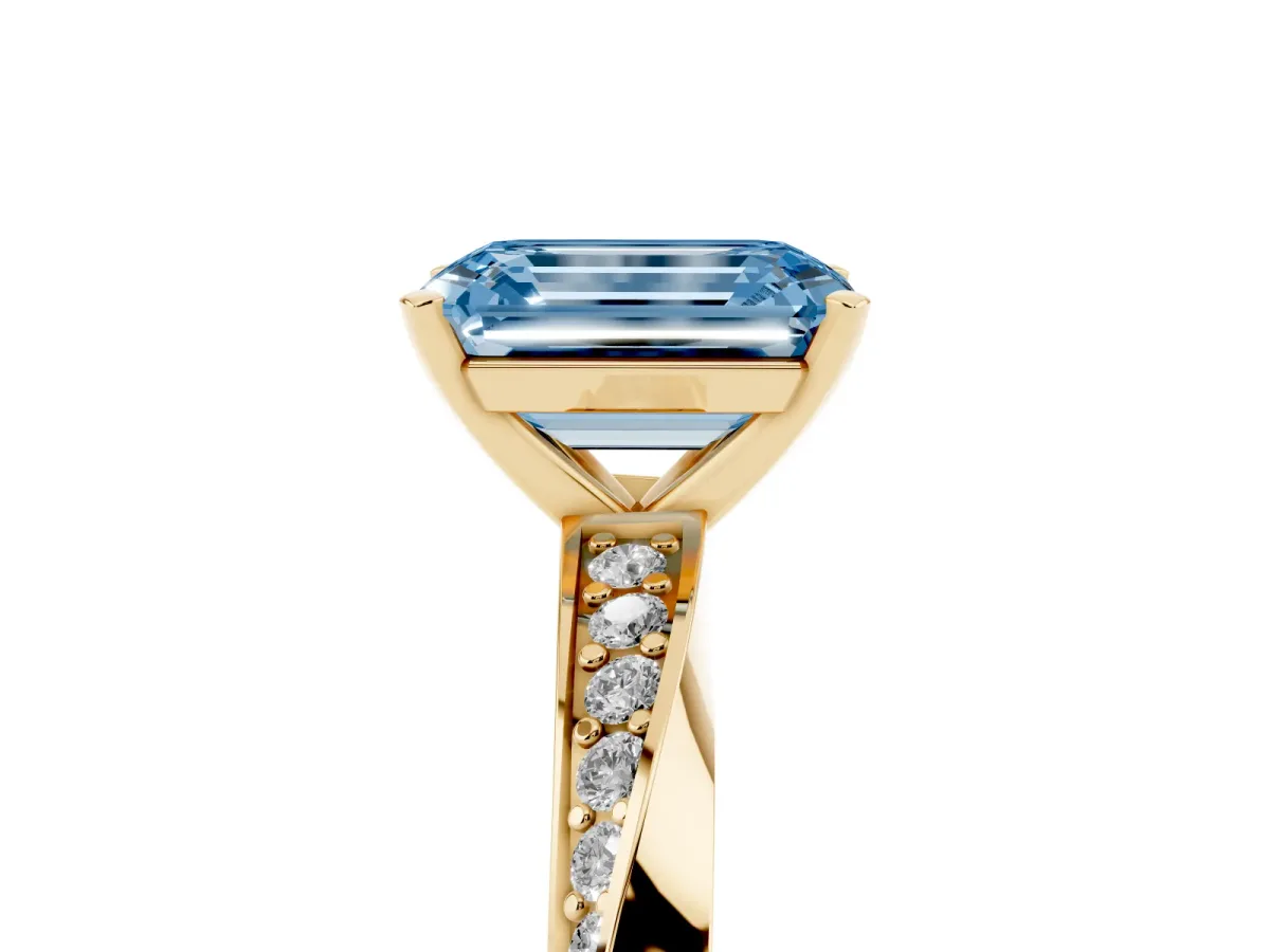 Fancy Blue Emerald Cut Diamond Engagement Ring with Side Stone Accents and Four-Prong Setting Yellow gold