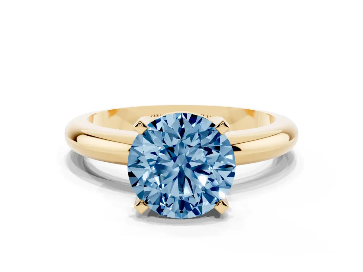 Fancy Blue Round Cut Diamond Solitaire Engagement Ring with Round Band and Four-Prong Setting Yellow gold