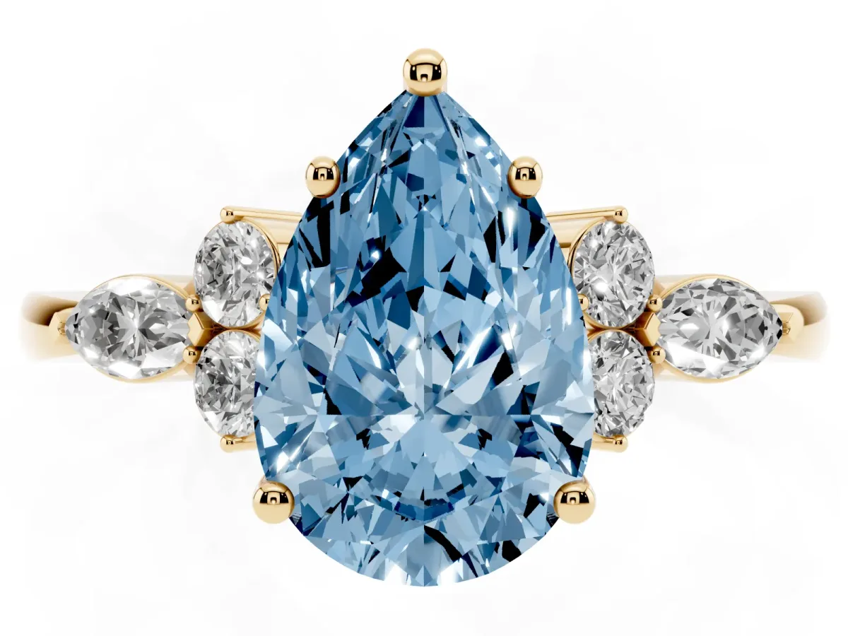 Fancy Blue Pear Cut Brilliant Diamond Solitaire Ring with Pear Side Stones and Four-Prong Setting Yellow gold