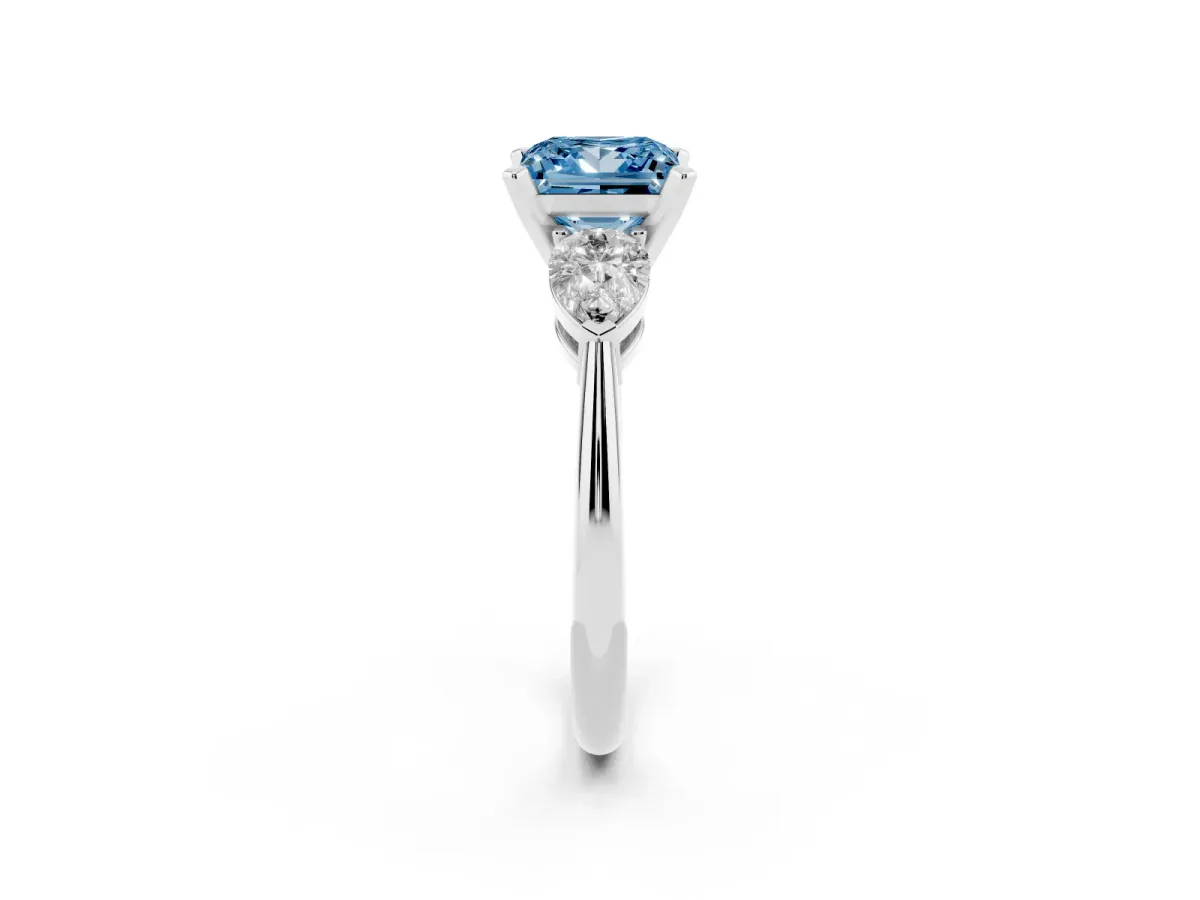 Fancy Blue Three-Stone Princess Cut Diamond Ring with Pear Side Stones and Four-Prong Setting Platinum