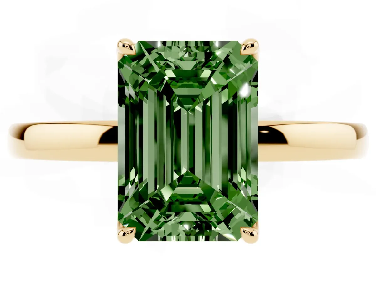 Fancy Green Emerald Cut Diamond Solitaire Ring with Thin Band and Prong Setting Yellow gold
