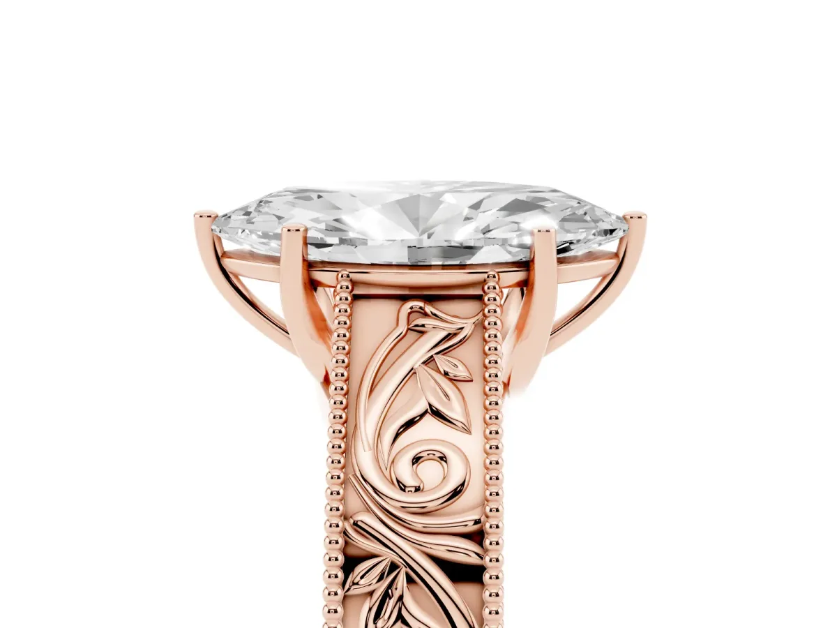 Marquise Cut Diamond Solitaire Ring with Engraved Band and Four-Prong Setting Rose gold