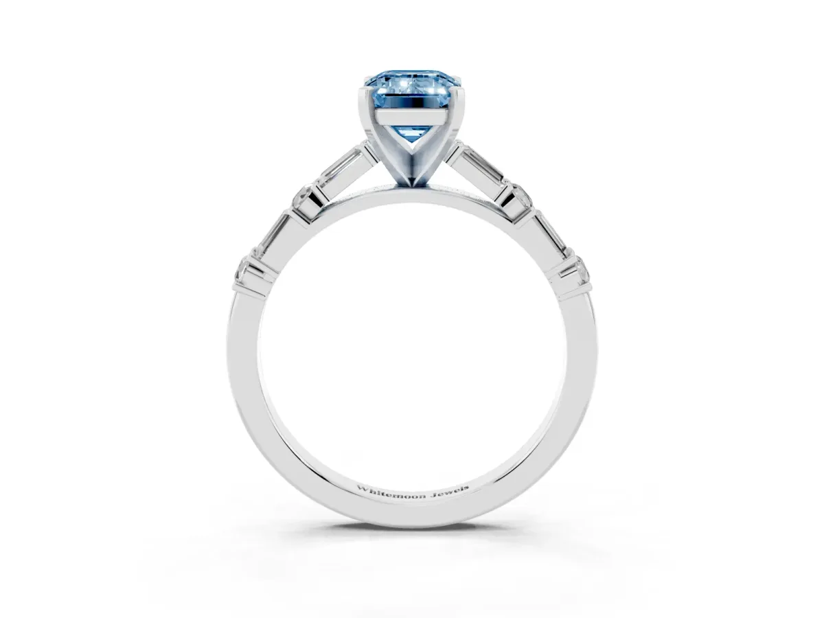Fancy Blue Emerald Cut Diamond Solitaire with Side Baguettes and Channel Set Band Platinum
