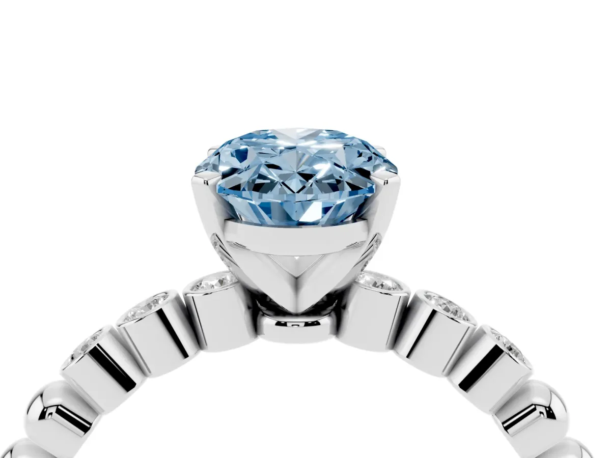 Fancy Blue Oval Cut Solitaire Bezel Accent Diamond Engagement Ring with Beaded Band and Four-Prong Setting White gold