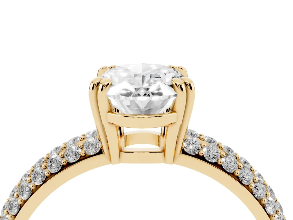 Oval Cut Diamond Solitaire Ring with Multi-Row Round Pavé Band and Prong Setting Yellow gold
