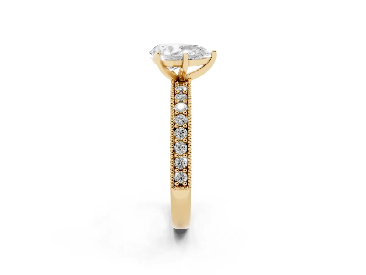 Pear Cut Diamond Milgrain Pavé Engagement Ring with Four-Prong Setting Yellow gold