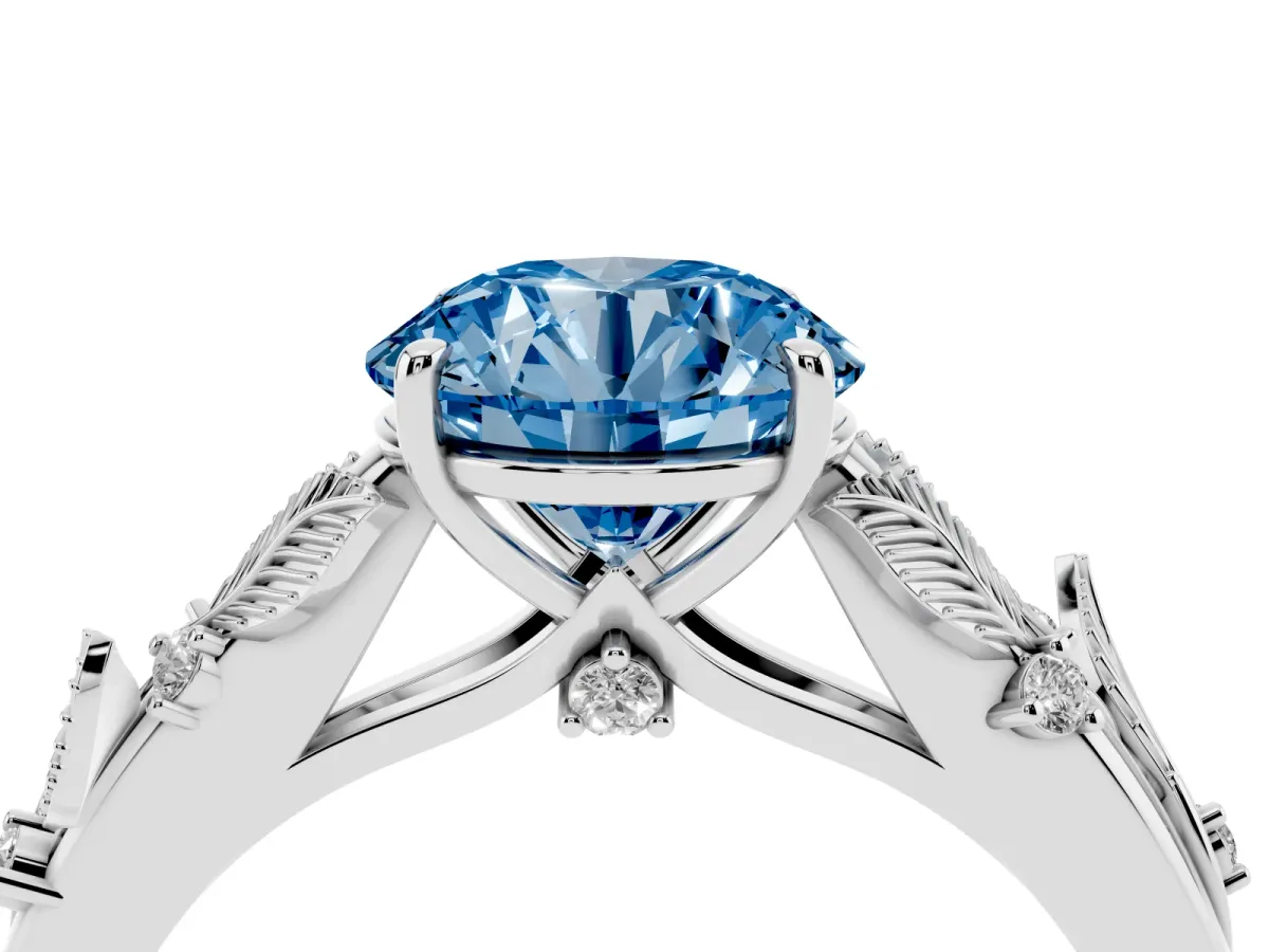 Fancy Blue Round Cut Diamond Solitaire Ring with Leaf Motif Band and Four-Prong Setting Silver