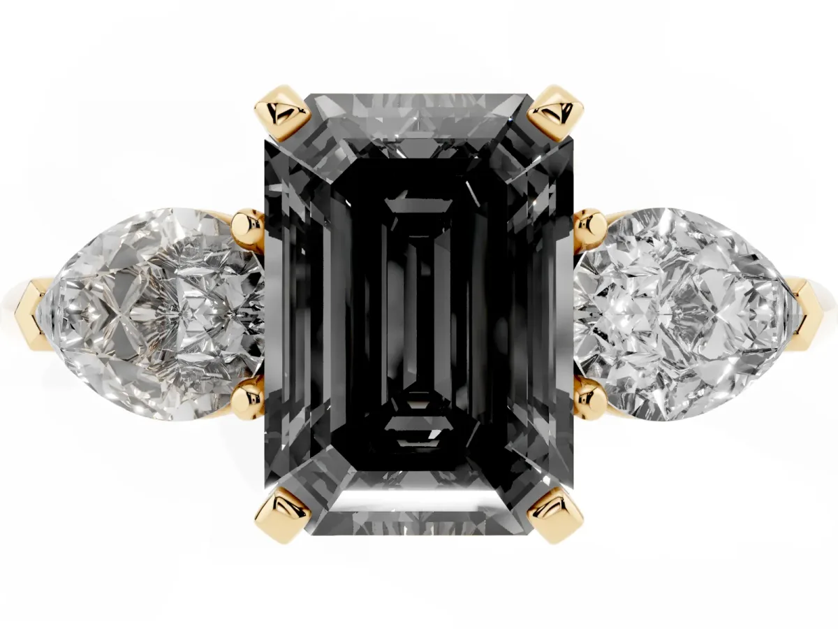 Fancy Black Three-Stone Emerald Cut Diamond Ring with Pear Side Stones and Four-Prong Setting Yellow gold